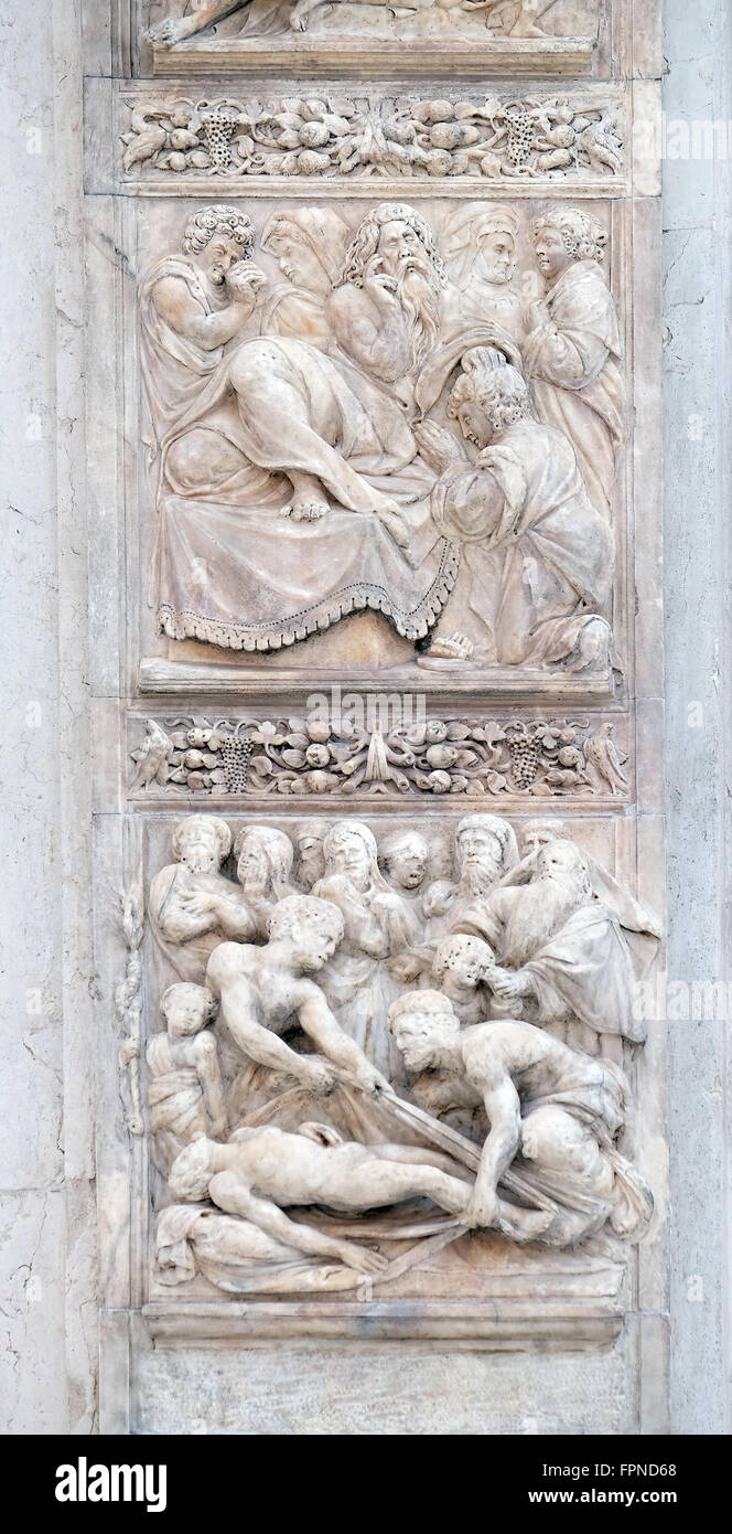 Isaac blesses Jacob up and Burial of Jacob's wife, left door of San Petronio Basilica in Bologna, Italy Stock Photo