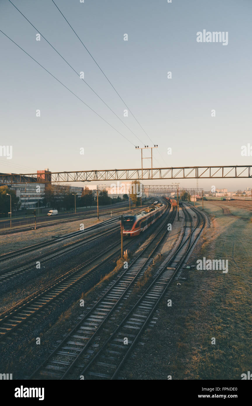 Motion of modern electric train at dawn, from above view Stock Photo