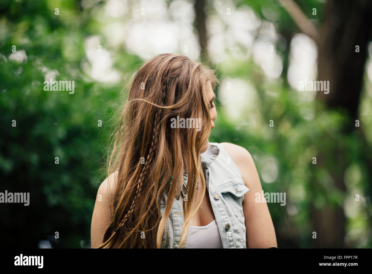 Young woman in the forest Stock Photo - Alamy