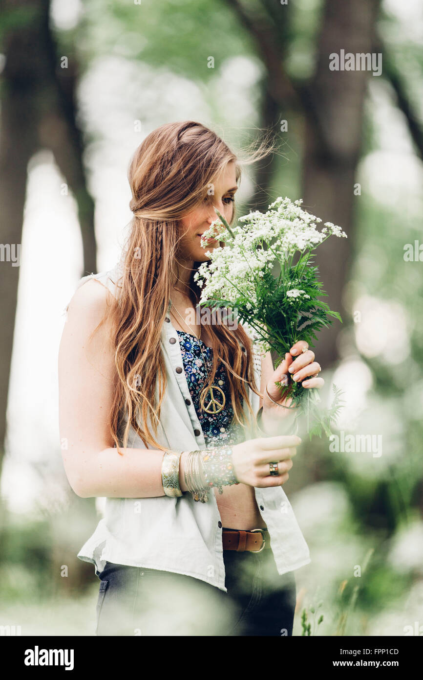 Young woman smelling bouquet, Stock Photo