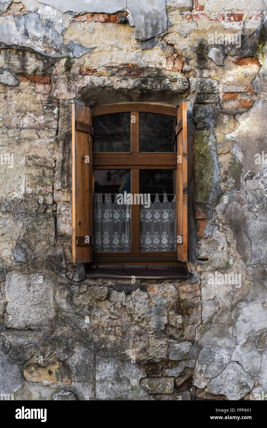 Vintage window with wooden shutters on the stoned house Stock Photo - Alamy