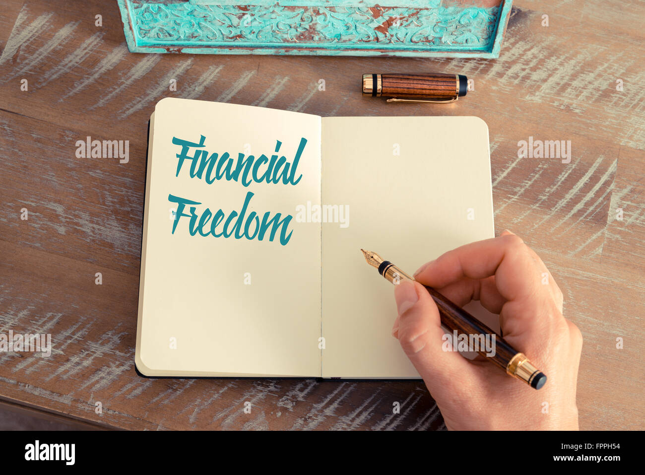 Handwritten text FINANCIAL FREEDOM, motivation concept Stock Photo - Alamy