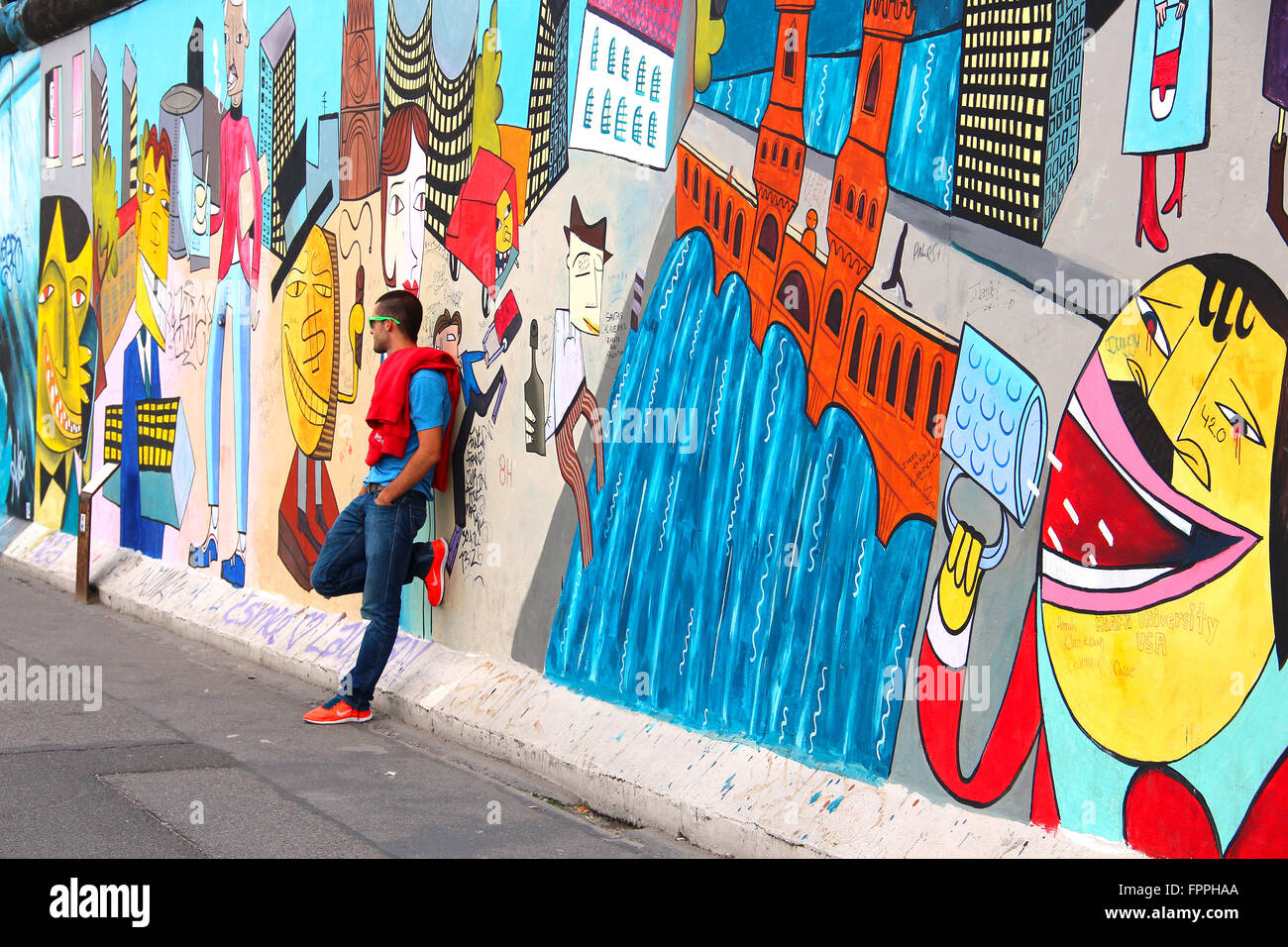 People taking pictures at East Side Gallery, the largest outdoor art