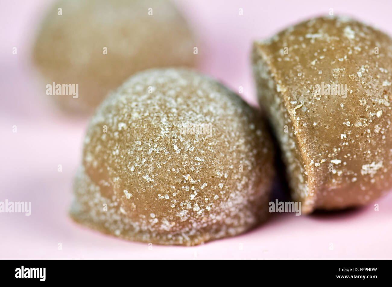 Close up of luxury continental or Belgian assorted chocolates on pink background Stock Photo
