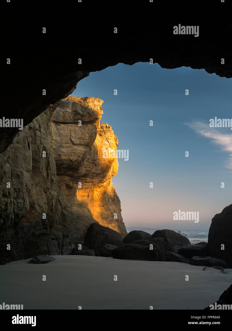 Sea cave at low tide. Devil's Punchbowl State Natural Area. Oregon Stock Photo