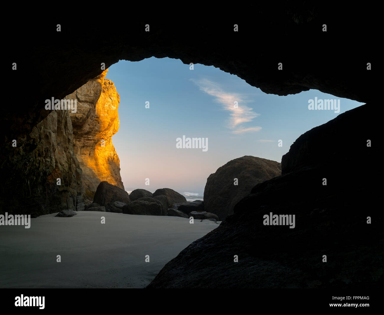 Sea cave at low tide. Devil's Punchbowl State Natural Area. Oregon Stock Photo