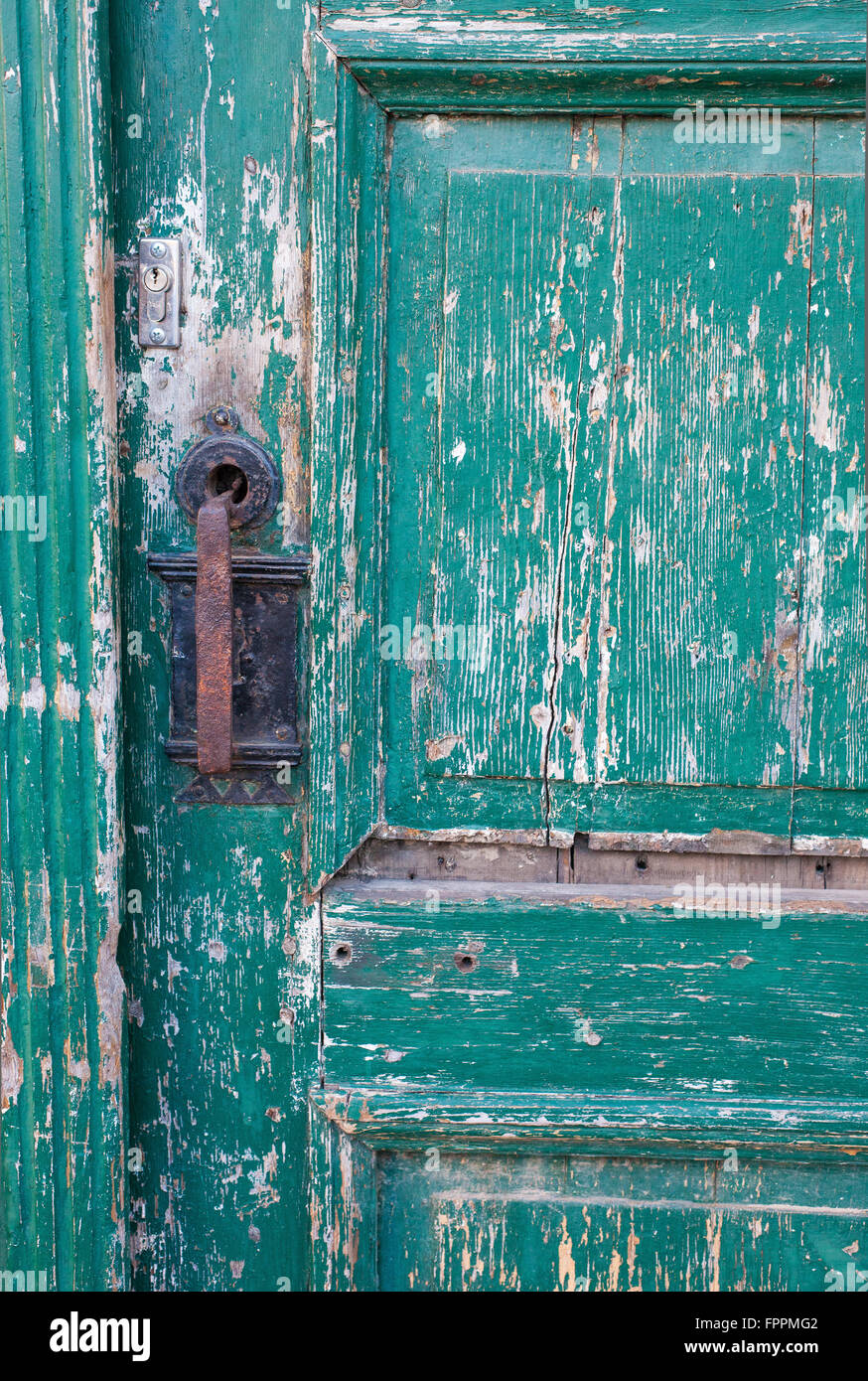 Weathered green painted door Stock Photo