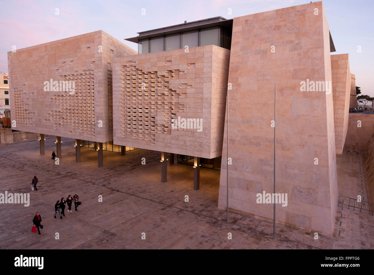 The blocks of the new parliament in Valletta are a minimalist and angular continuity of the nearby pentagonal Cavalier. Stock Photo