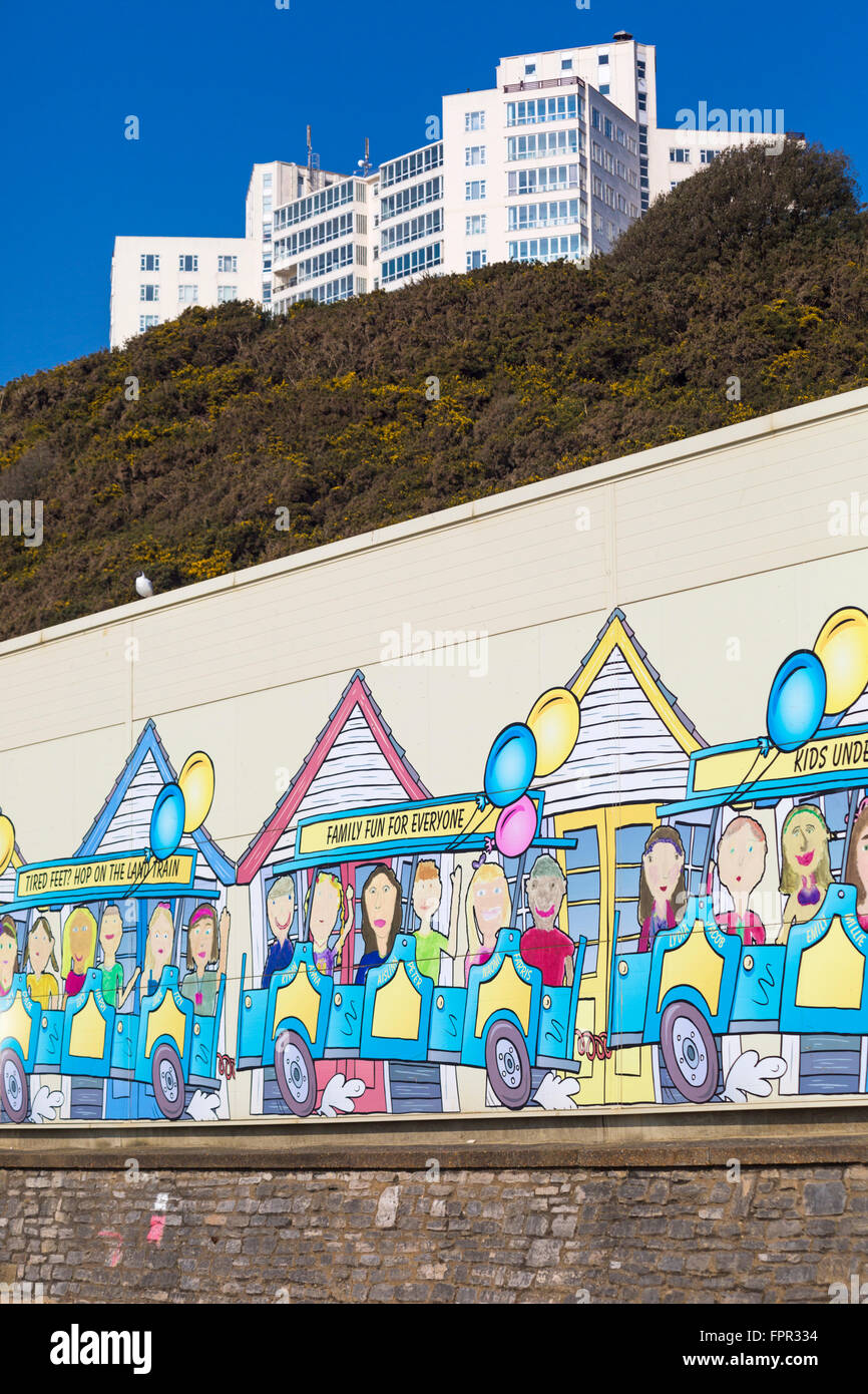 Painting of the beach huts on the side of landtrain shed building between Bournemouth and Boscombe piers Stock Photo