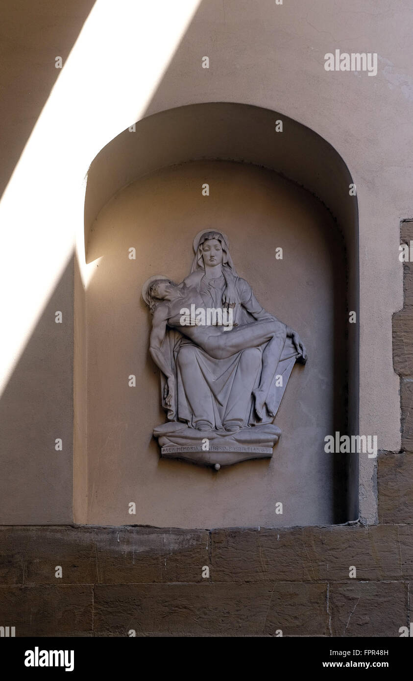 Pieta, statue on the house facade in Florence, Italy, on June 05, 2015 Stock Photo