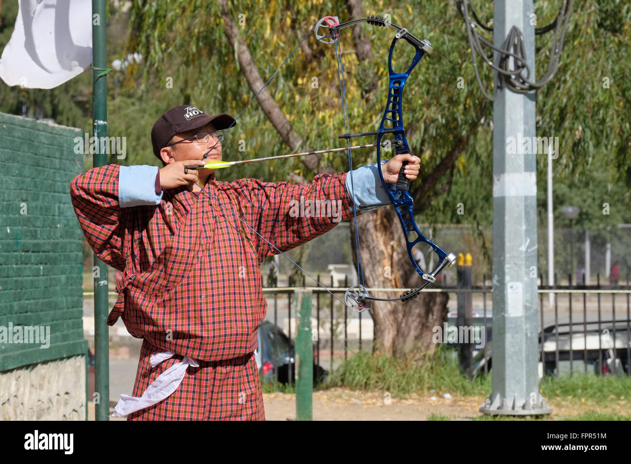 An archer taking aim during an archery competition. Thimphu, Bhutan. Stock Photo