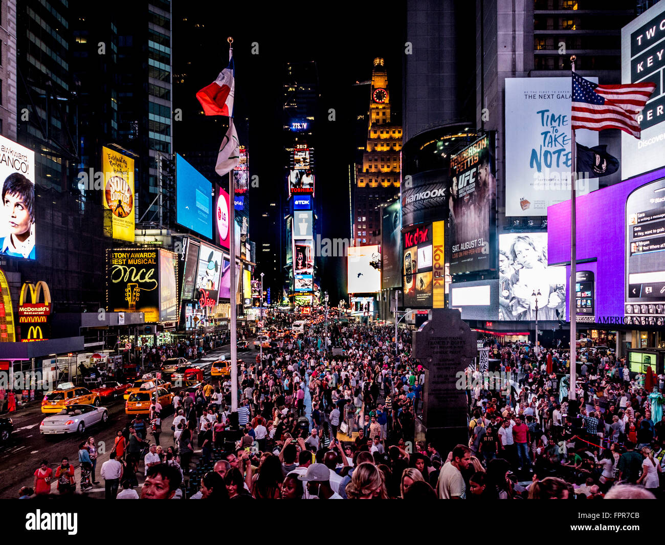 Crowd of people in Times Square at night, New York City, USA. Stock Photo