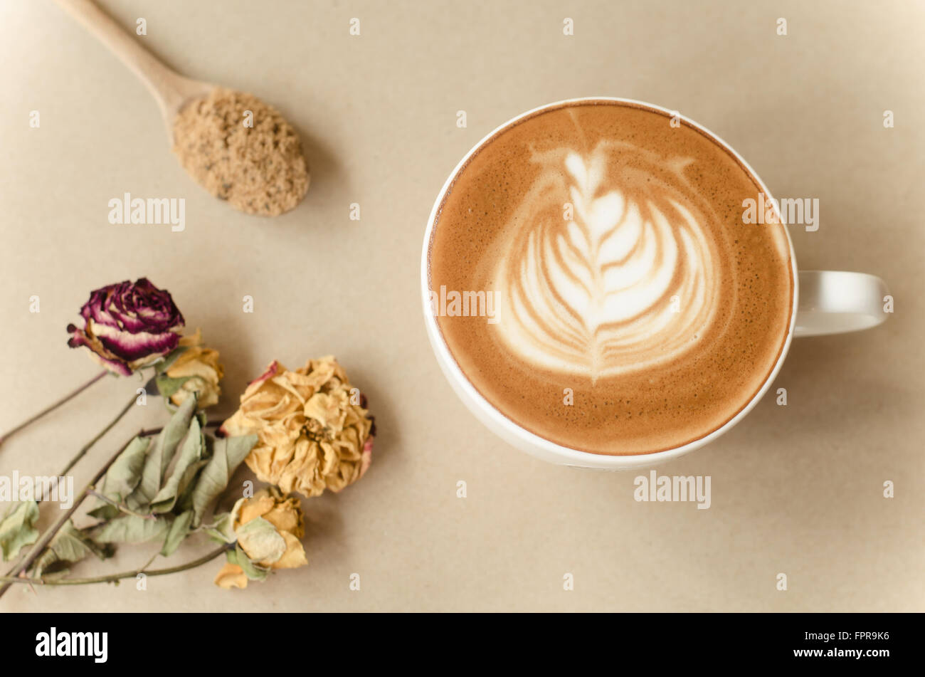 a cup of latte art on brow background, vintage coffee Stock Photo