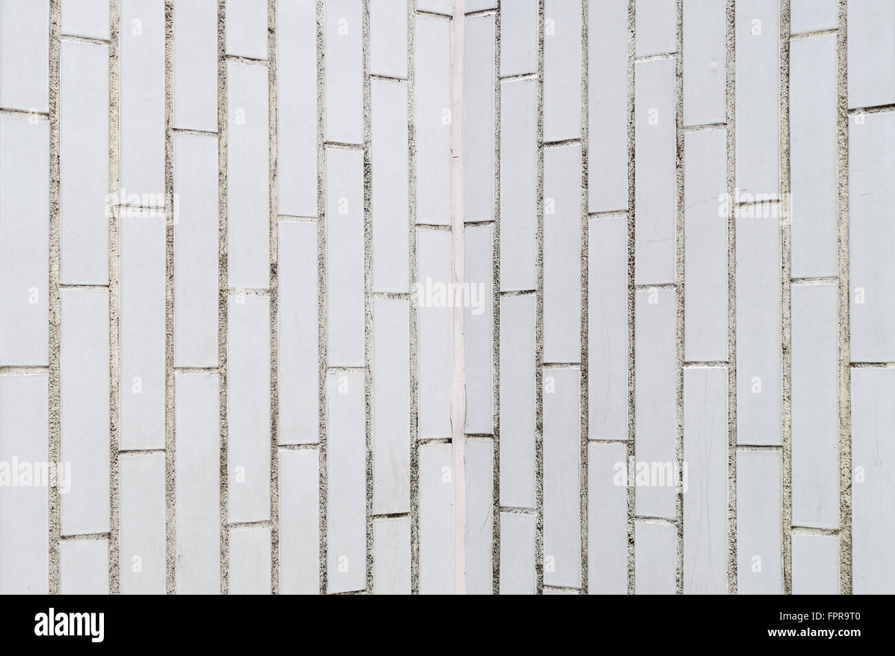 Background of white rectangle brick wall, vertical pattern Stock Photo