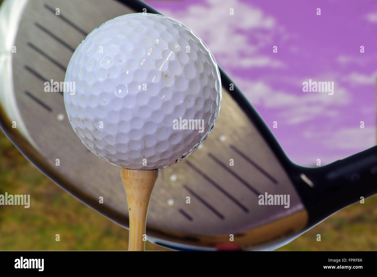 Golf ball lined up with the sweet spot Stock Photo