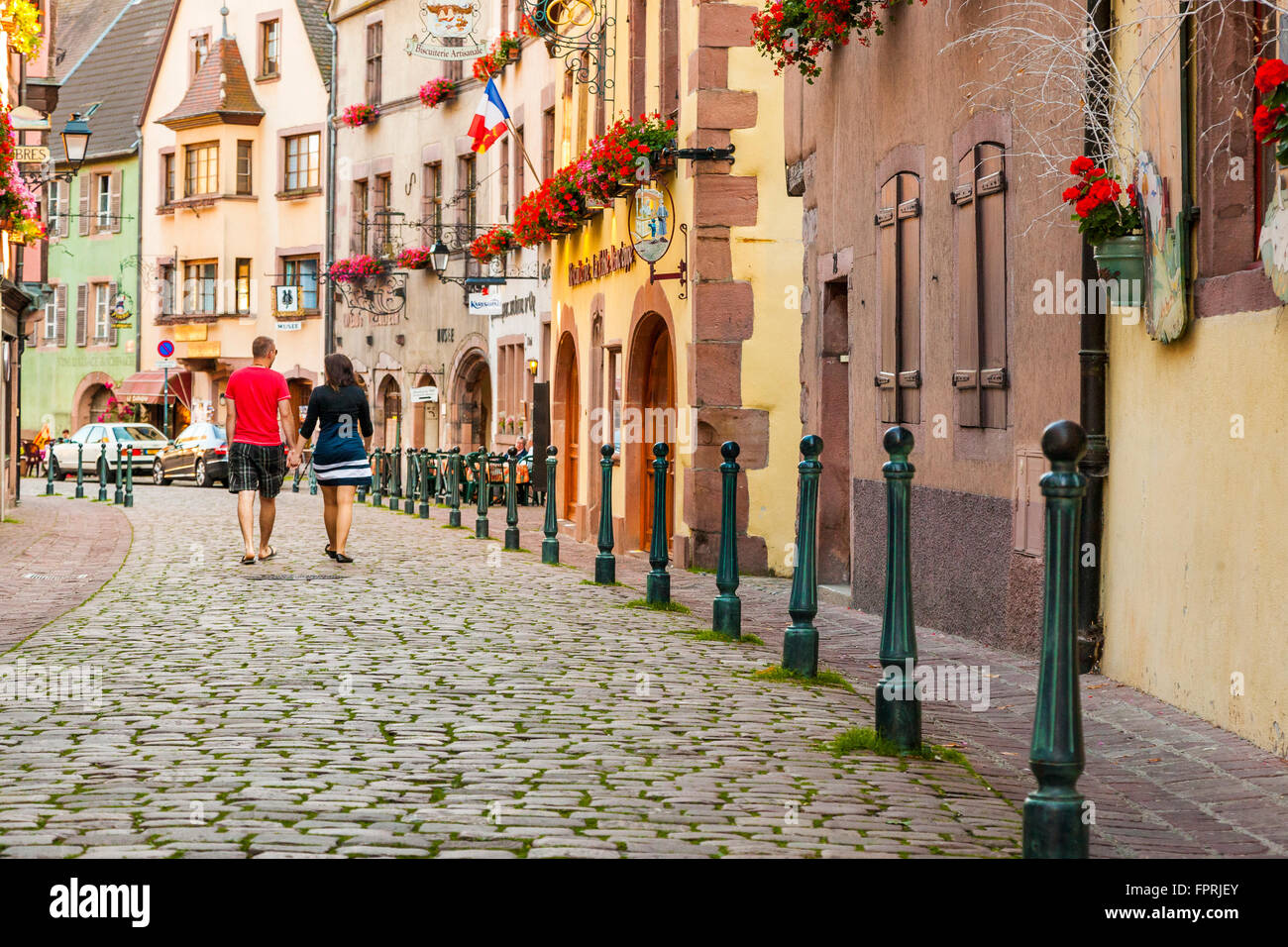 Two tourist walking along the route of Kaysersberg Alsace Haut Rhin France Stock Photo