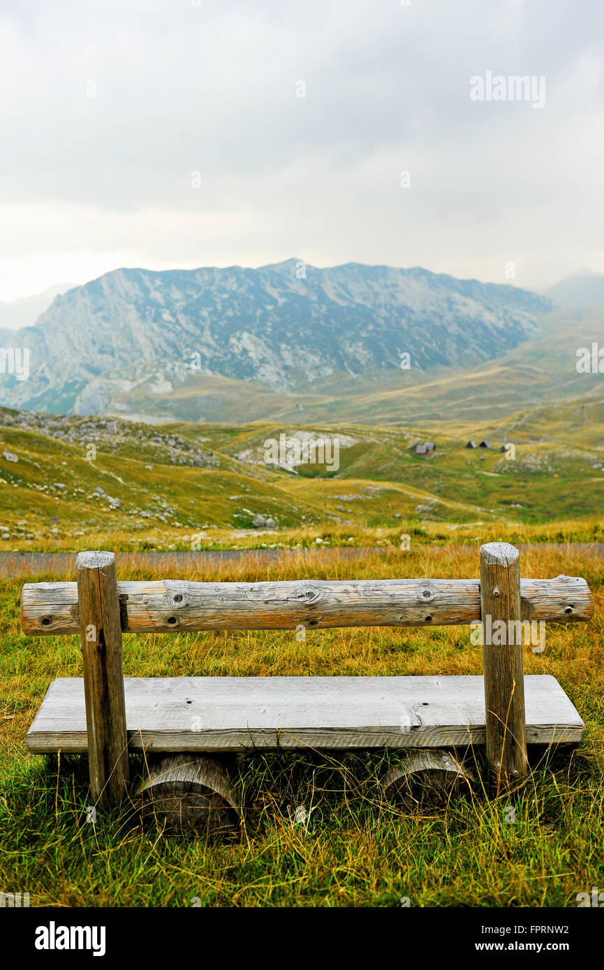 Empty wooden bench on Sedlo Pass in Durmitor National Park in Montenegro Stock Photo