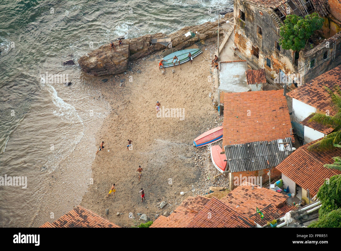 A football match on the beach in a favela in Salvador, Bahia, Brazil Stock Photo