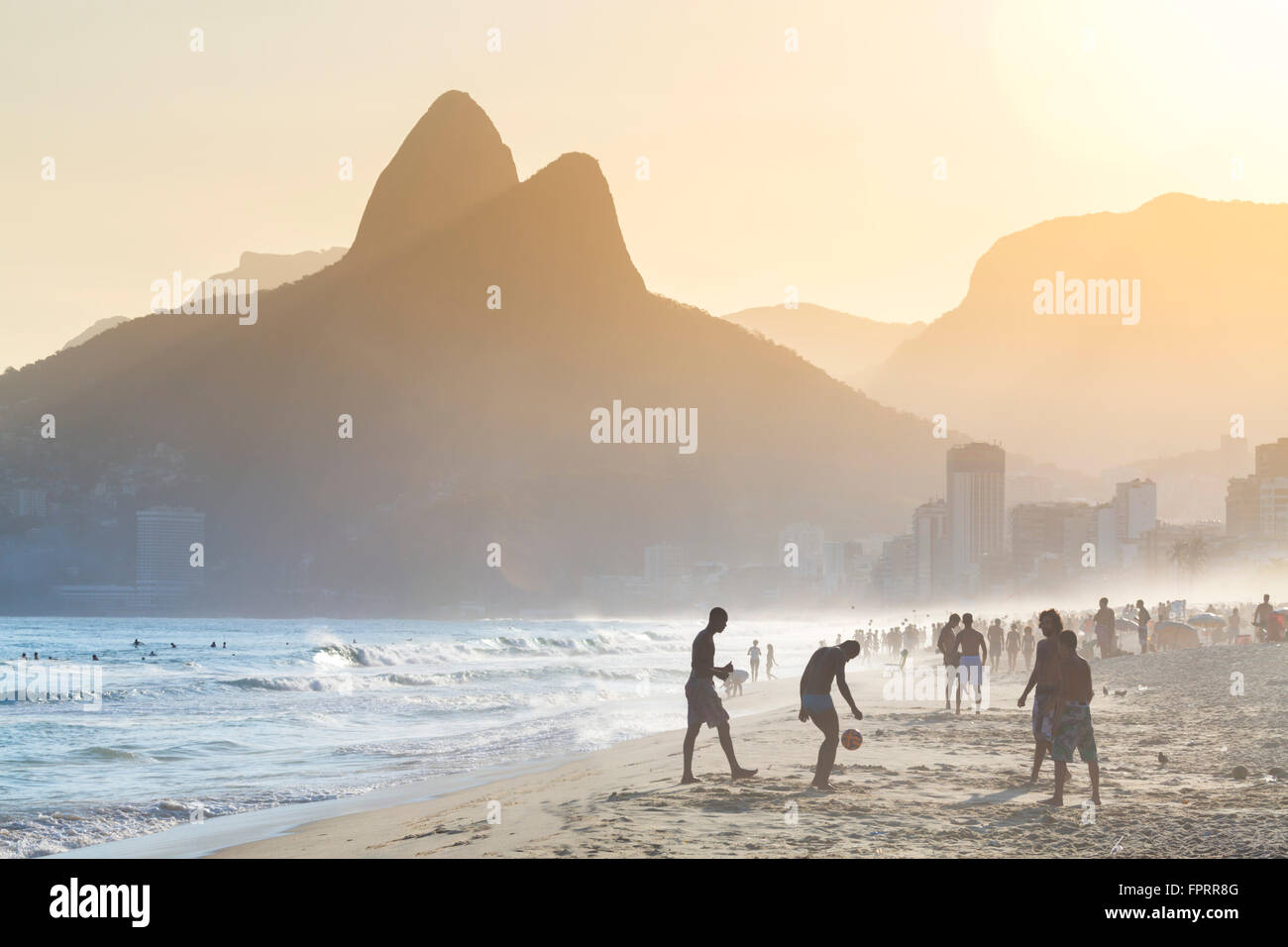 View of footballers on Ipanema (foreground) Leblon (background) beaches in Rio de Janeiro Stock Photo