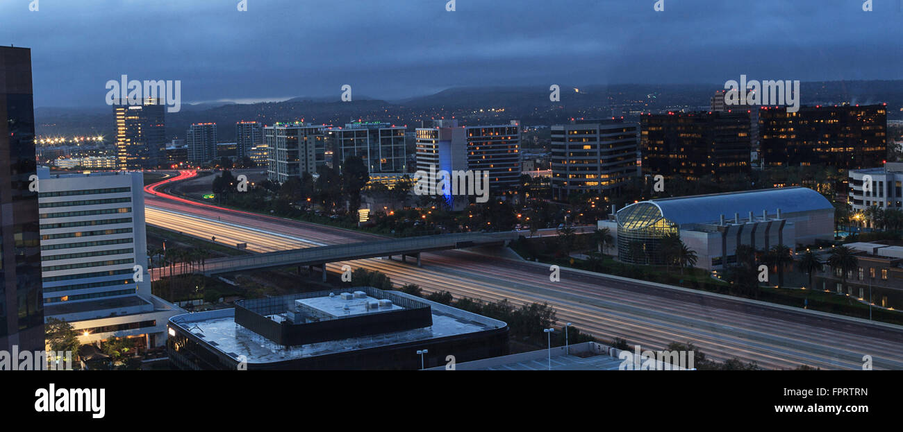 City lights highway aerial view of Newport Beach, California in Orange County at dusk. Stock Photo