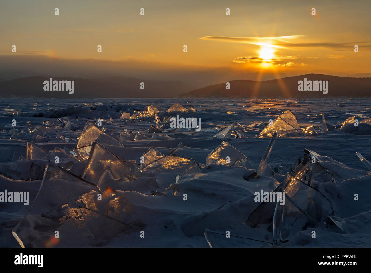 Transparent pieces of ice and the rising sun Stock Photo - Alamy