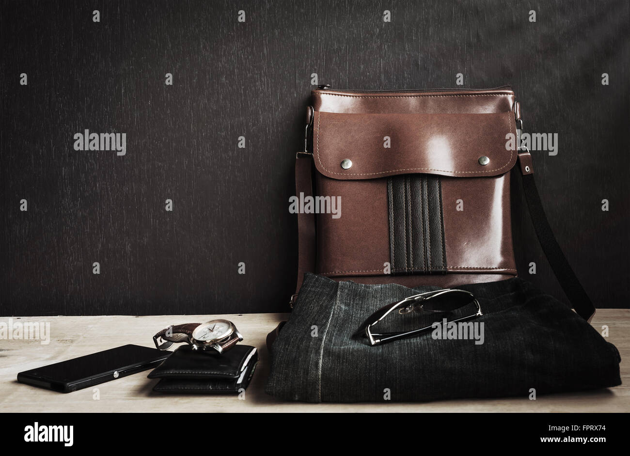 Outfit of traveler, Different objects on wooden background, Vintage style and dark tone Stock Photo