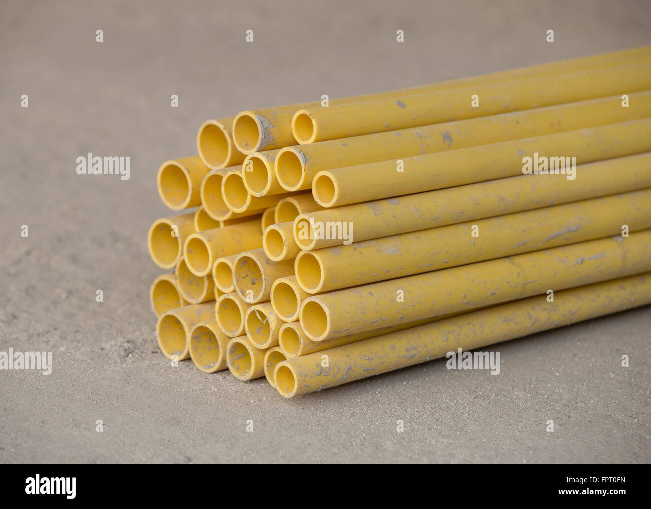 yellow PVC pipes for electric conduit Stock Photo