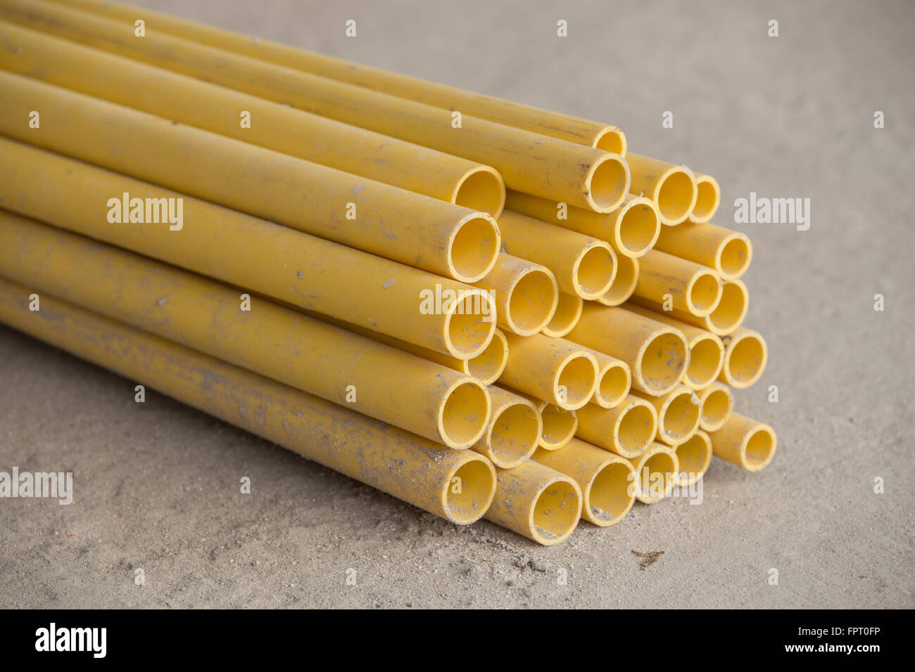 yellow PVC pipes for electric conduit Stock Photo