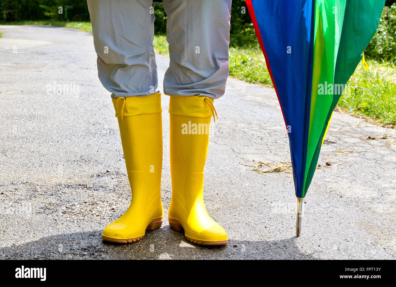 Legs girl wearing rubber boots hi-res stock photography and images - Alamy