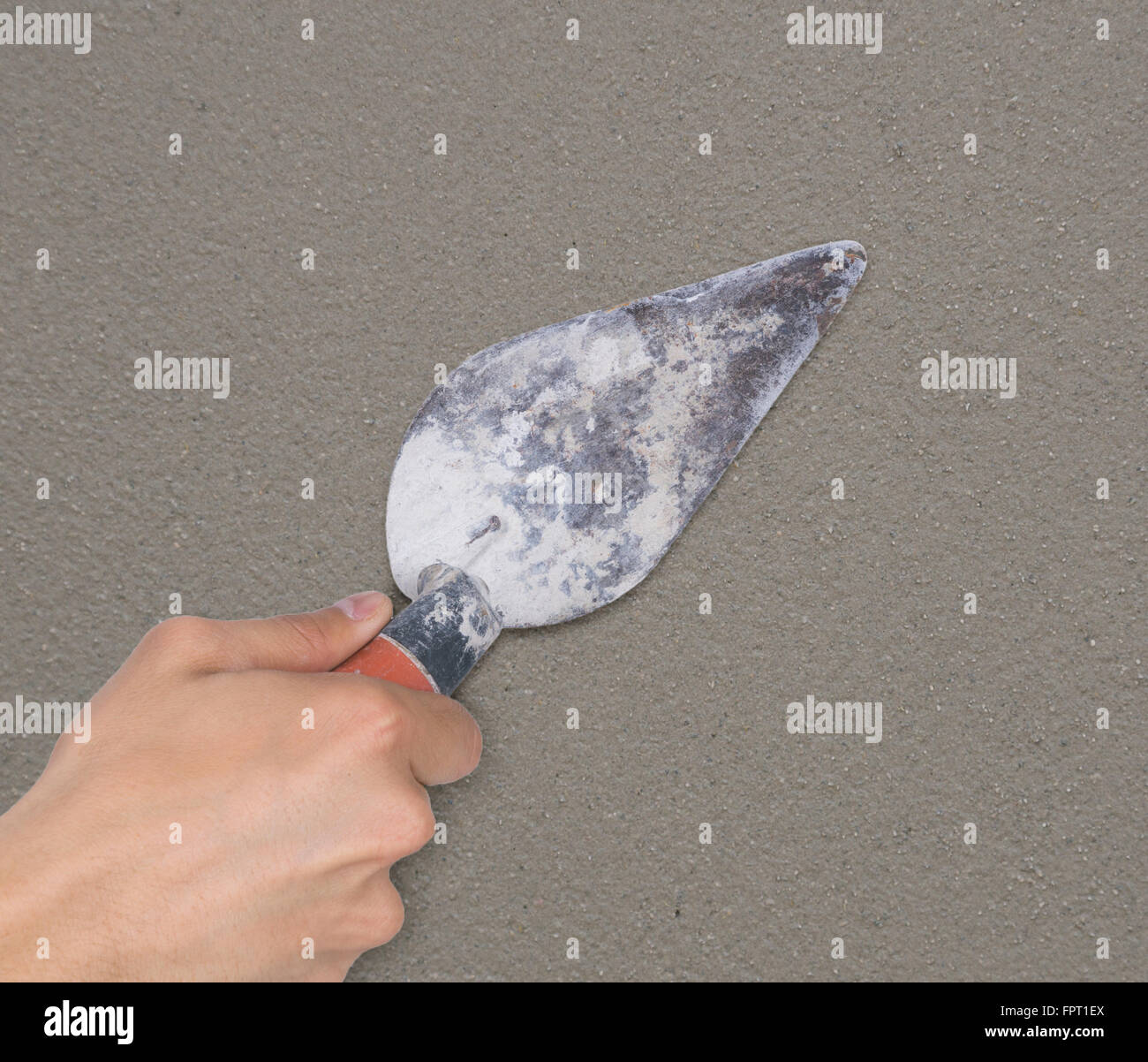 hand of builder worker use trowel plastering concrete at wall Stock ...