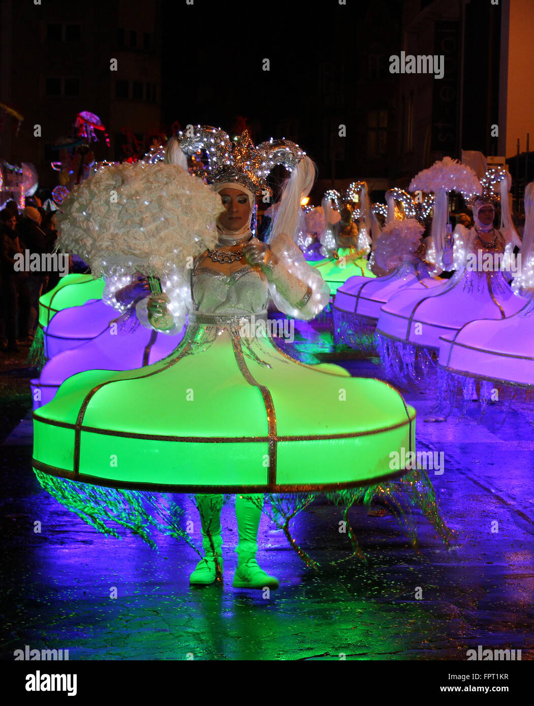 AALST, BELGIUM, FEBRUARY 7 2016: Unknown participants in illuminated costume during the annual carnival parade in Aalst. Stock Photo