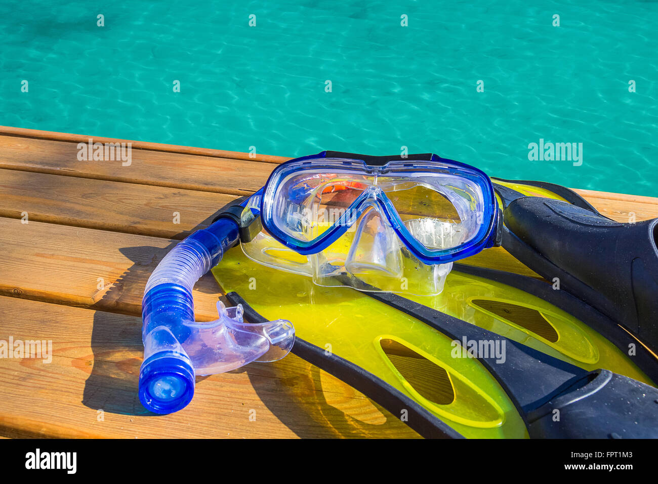Snorkeling gear on a wood pier Stock Photo