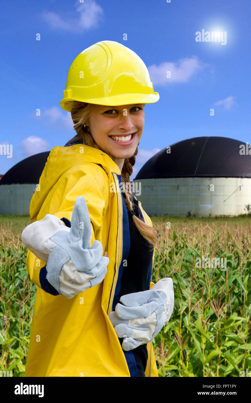 Young, happy woman on a biogas plant Stock Photo