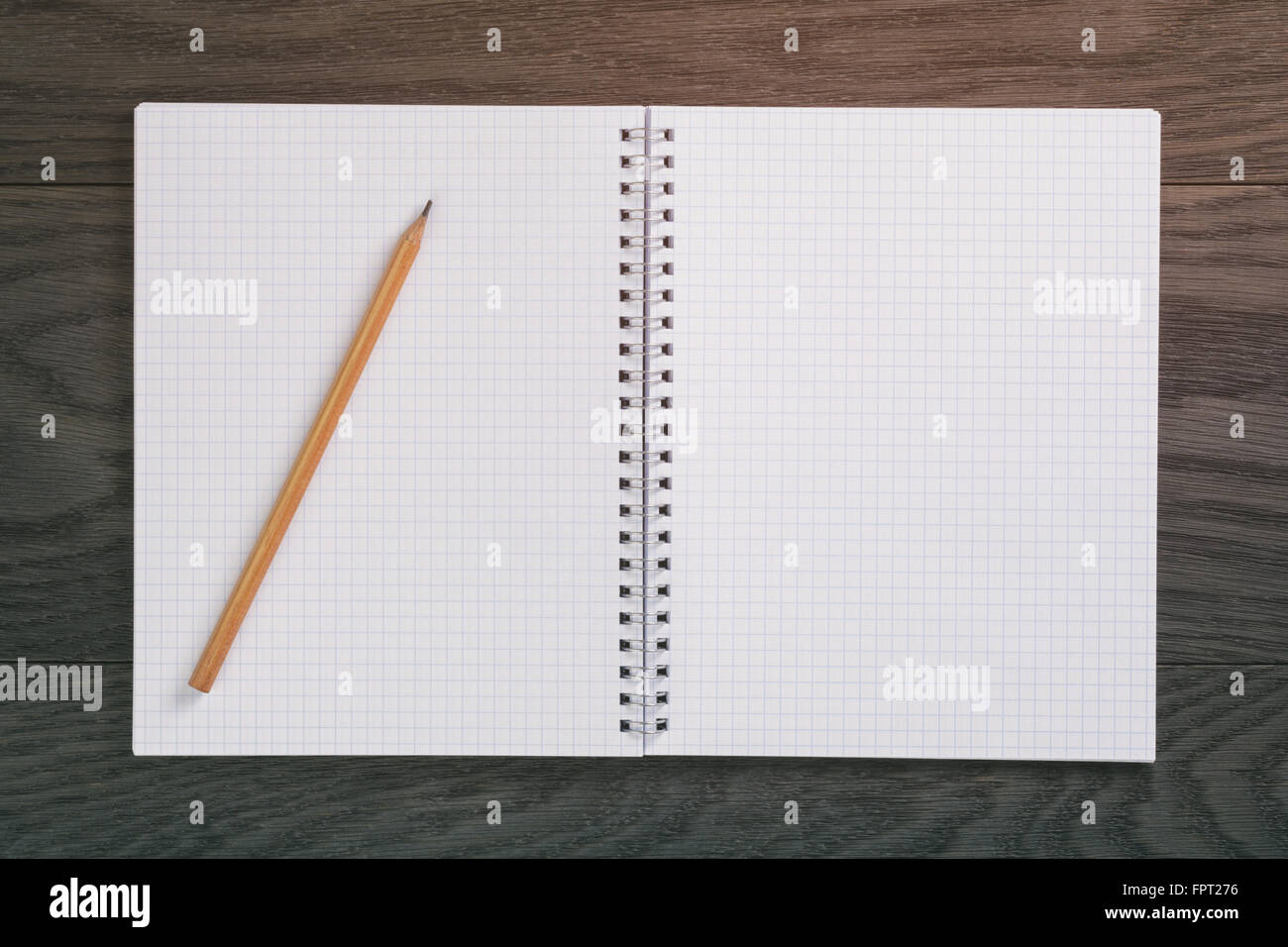 notepad with pencil on wood table Stock Photo - Alamy