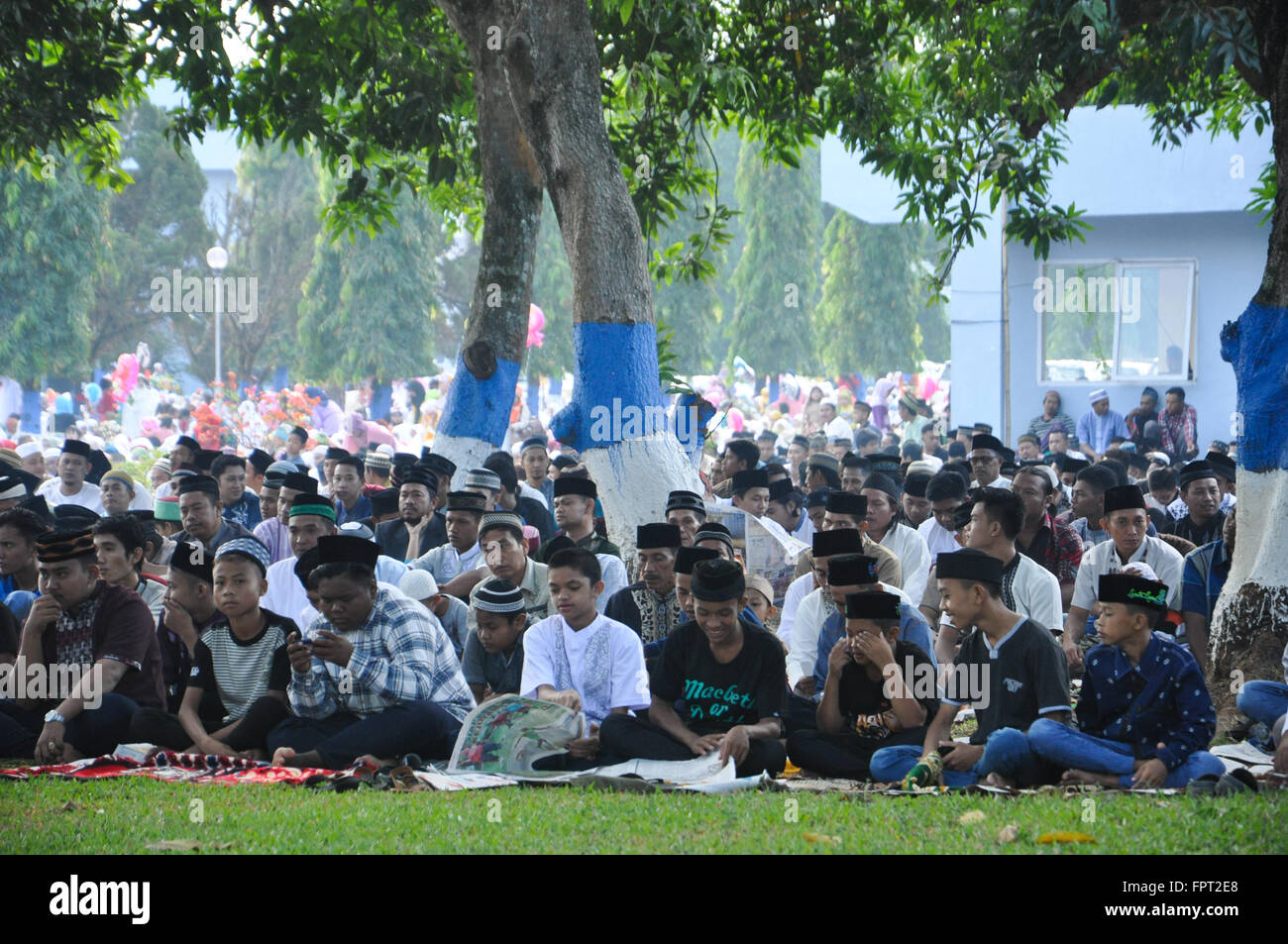 Indonesian Moslems gathered at Air Force Residence Field in Makassar , Indonesia to held Eid Al-Fitr prayer to celebrate the end Stock Photo