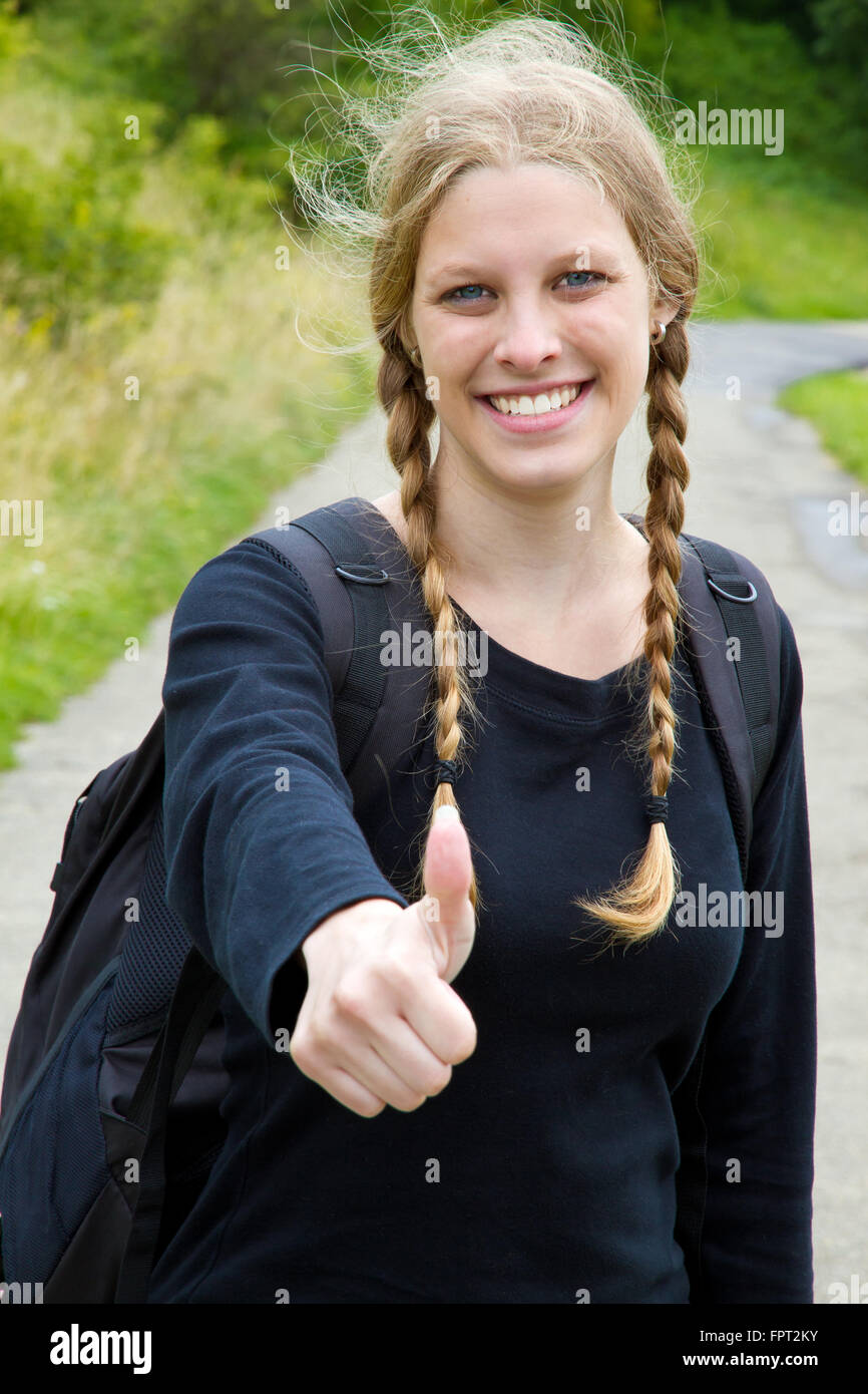 Young, happy woman with thumb up Stock Photo