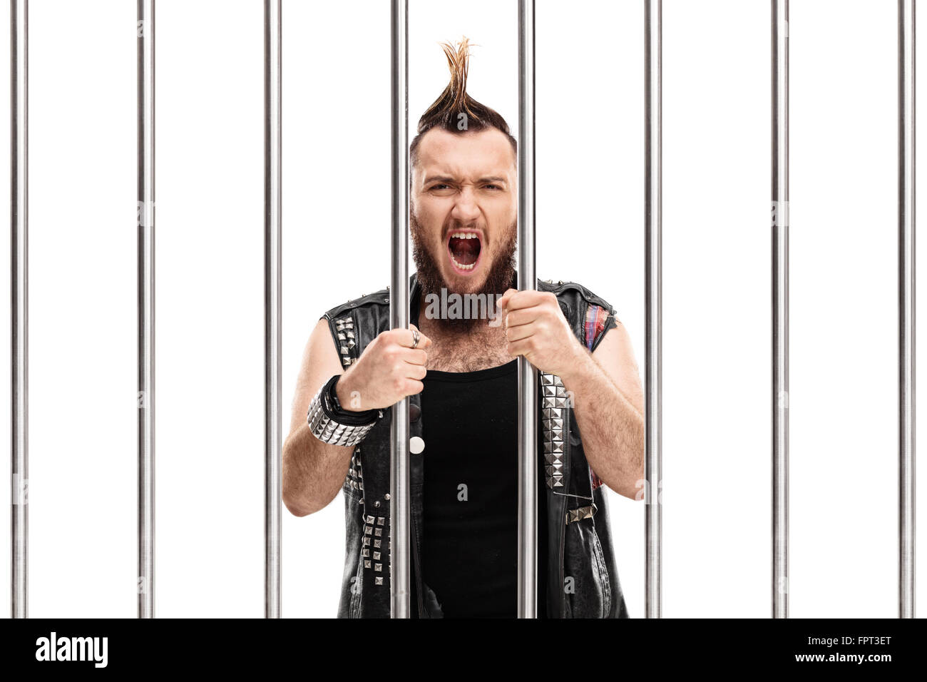 Angry punk rocker standing in jail and shouting isolated on white