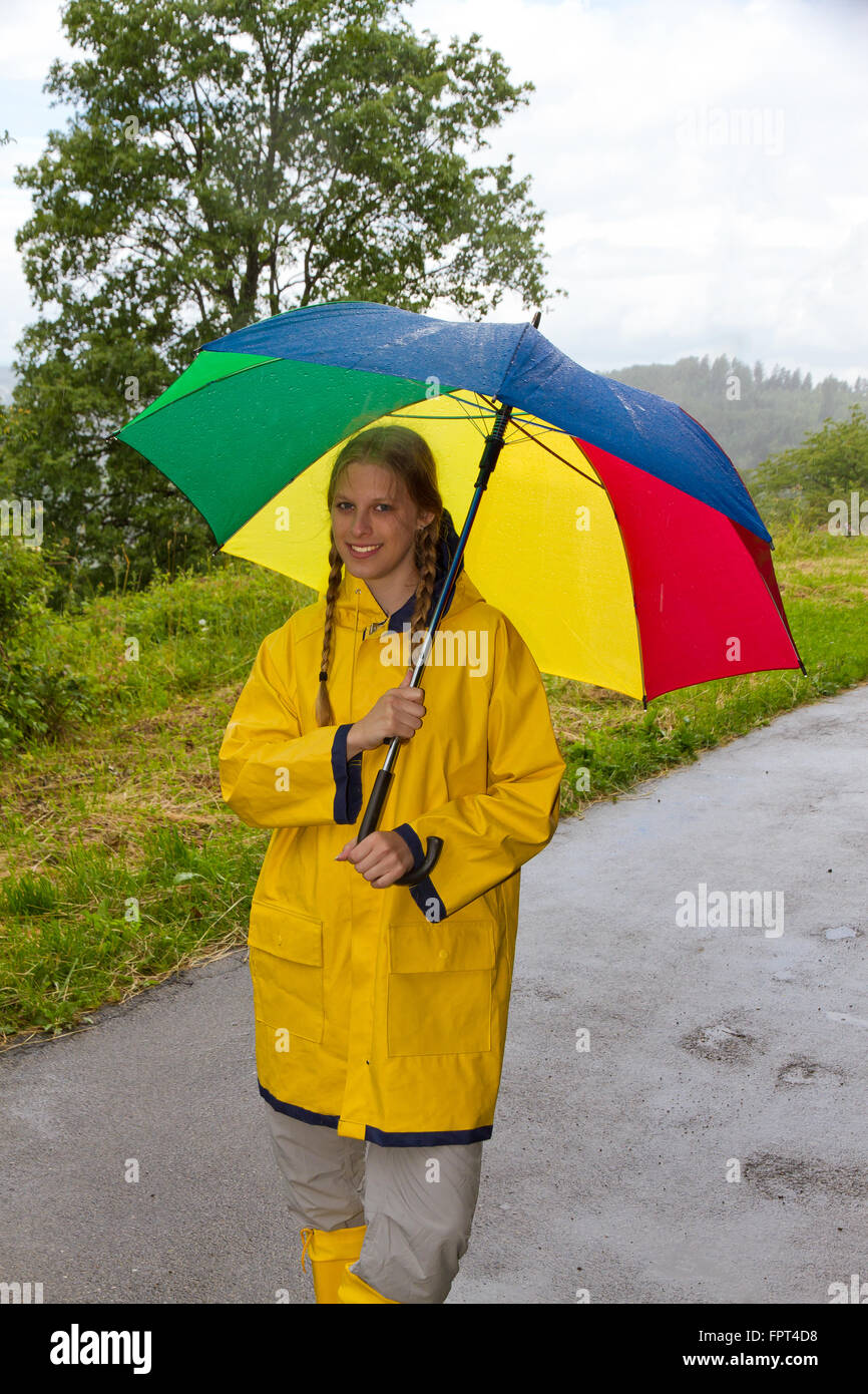 Yellow raincoat hi-res stock photography and images - Alamy