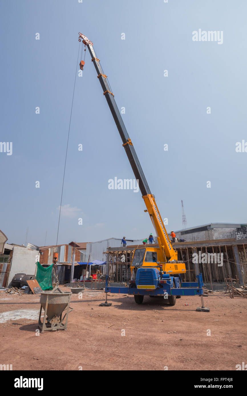 NAKHON RATCHASIMA FEB 19 Crane lifting concrete mixer container at