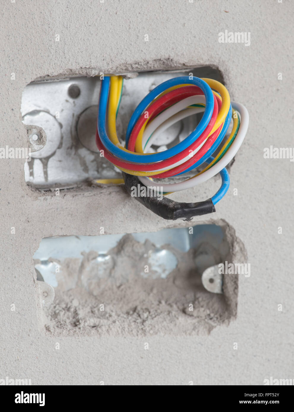 electric wire with concrete wall at construction site Stock Photo Alamy