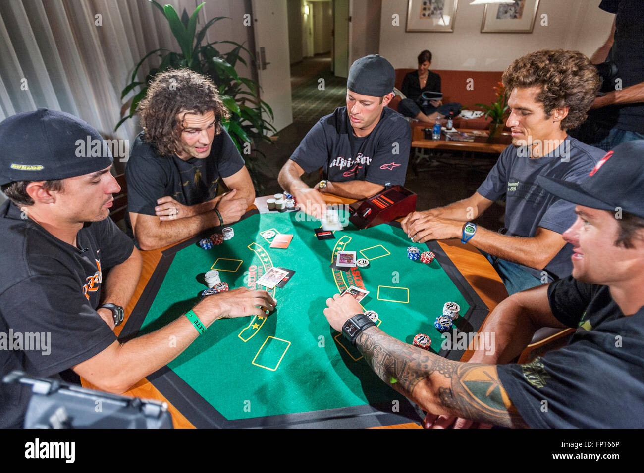 LOS ANGELES, CA AUGUST 08 X Game athletes playing a poker game in