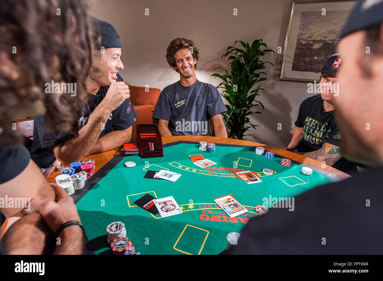 LOS ANGELES, CA AUGUST 08 X Game athletes playing a poker game in