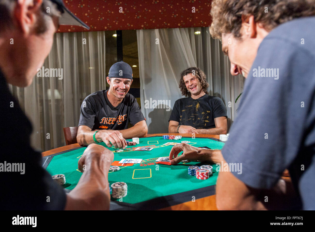 LOS ANGELES, CA AUGUST 08 X Game athletes playing a poker game in