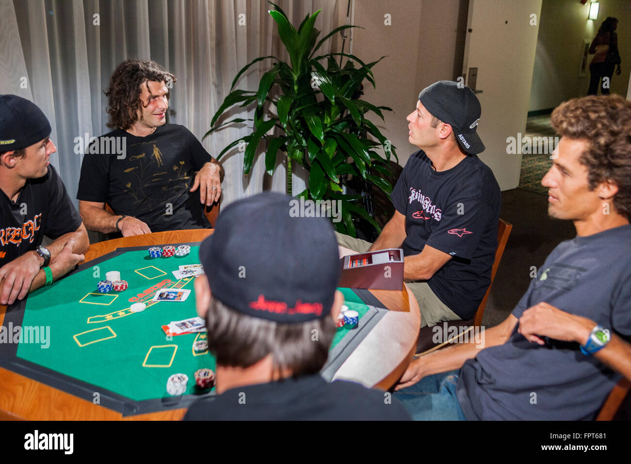 LOS ANGELES, CA AUGUST 08 X Game athletes playing a poker game in