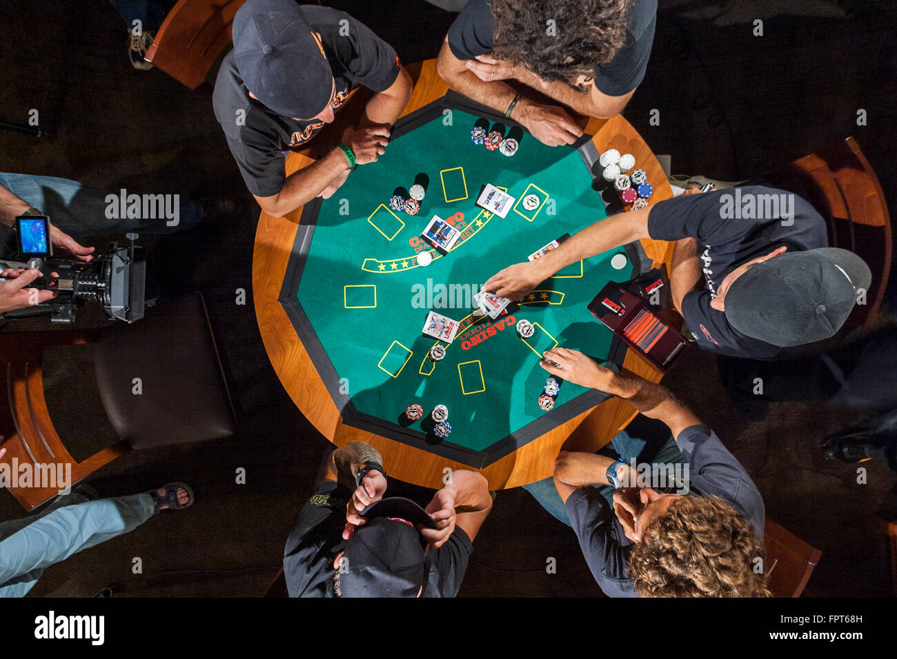 LOS ANGELES, CA AUGUST 08 X Game athletes playing a poker game in