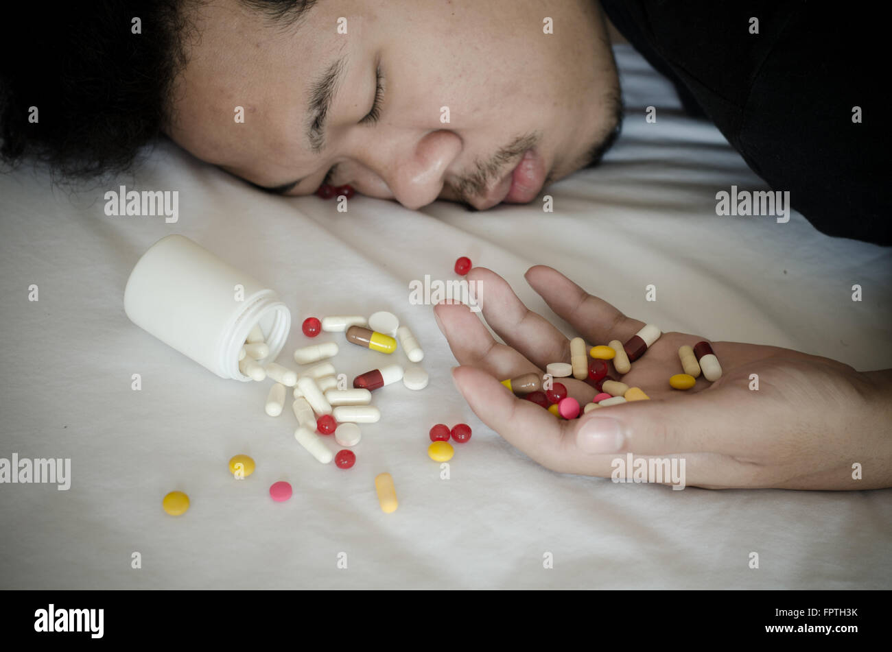 drug addict laying on the bed Stock Photo