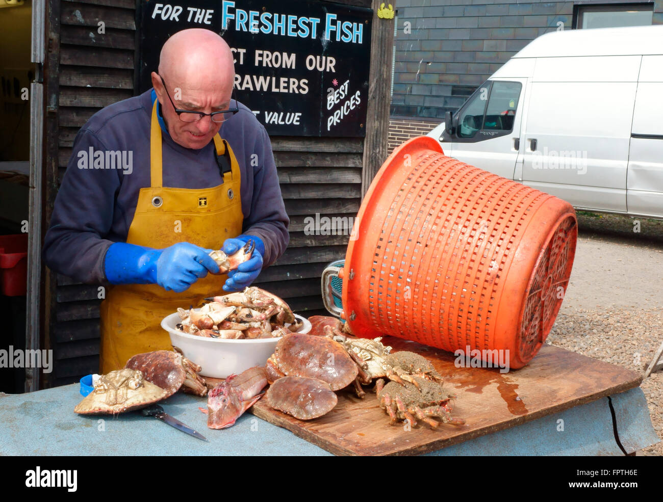 Hastings fisherman preparing crab claws on the Stade, Hastings seafront, East Sussex, England, UK, GB Stock Photo