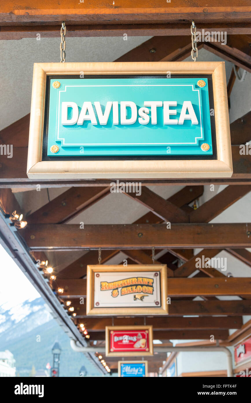Restaurant and shop signs in Banff Avenue a tourist town in the Canadian Rockies Canada including Davids Tea Stock Photo