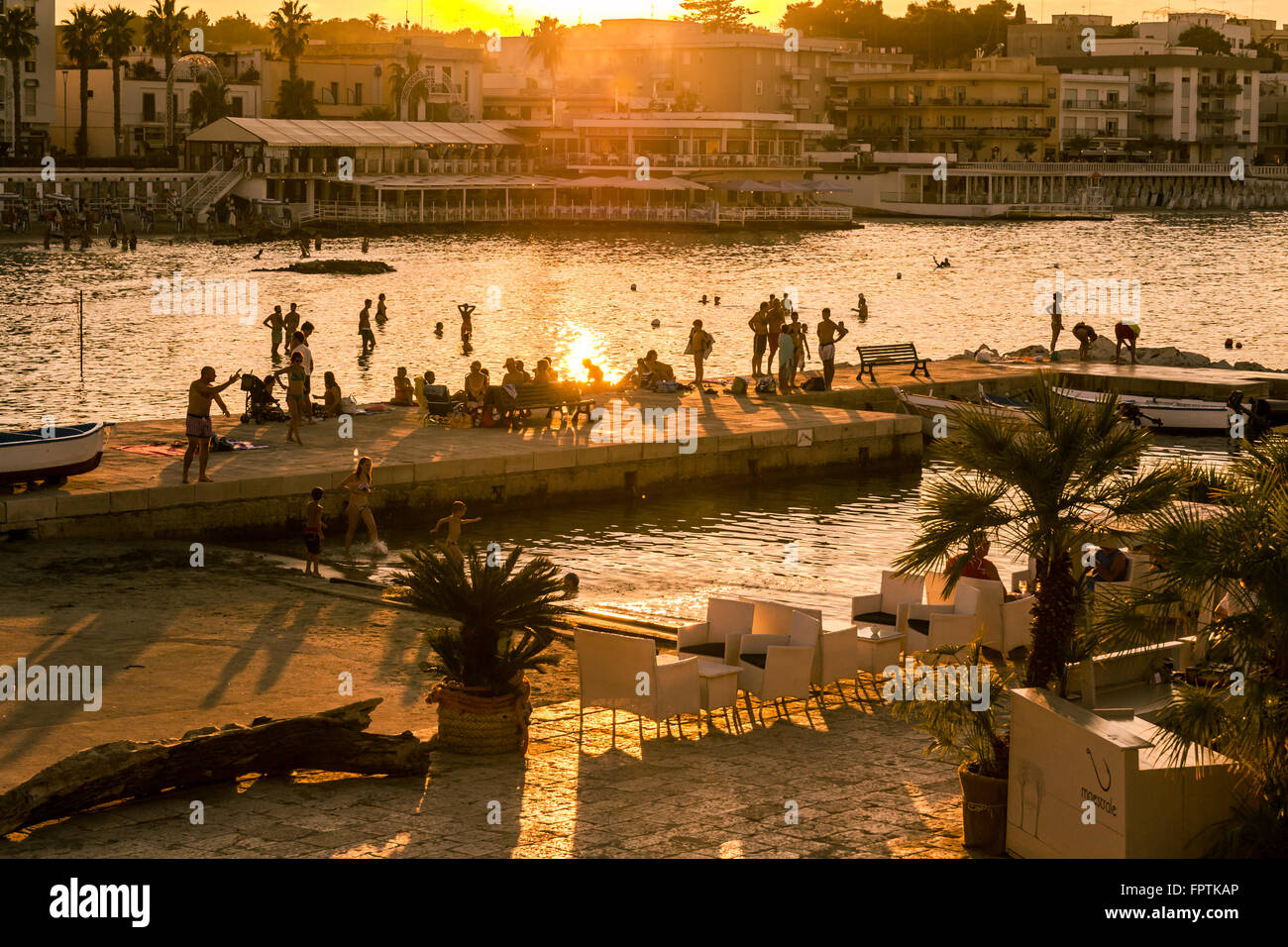 Otranto, Italy - Monday 11, 2014: Sunset on the seafront at Otranto in southern Italy. Stock Photo