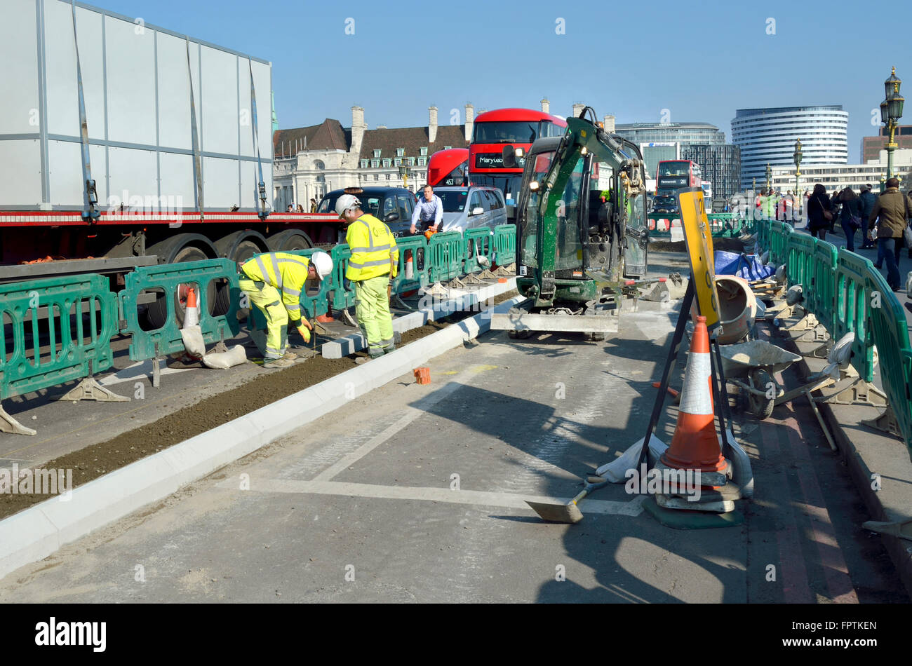 London, England, UK. Constructing a new cycle lane on Westminster Bridge, March 2016 the cycle 'Superhighway' Stock Photo